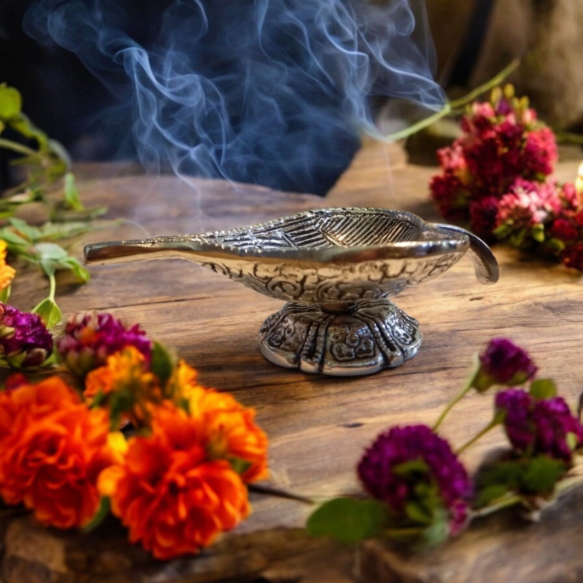 A silver leaf shaped incense holder